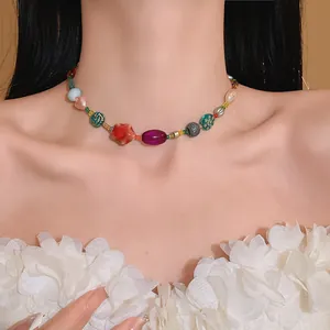 Dopamine style necklace with colorful ceramic and glass beads on a model's neck