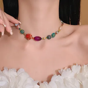 Detailed view of dopamine style colorful beaded necklace with ceramic and glass beads