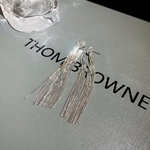 Detailed view of elegant silver metallic tassel earrings with s925 needle for women
