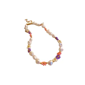 Elegant handmade seed bead flower necklace featuring irregular pearls and gold plating finish