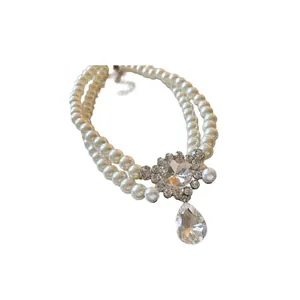 Elegant double-layer faux pearl necklace with sparkling rhinestone water drop pendant