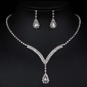 Elegant silver-tone wedding jewelry set with teardrop crystal necklace and matching earrings