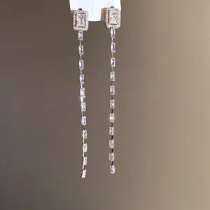 Elegant silver needle earrings with square zircon stones and long shimmering tassels