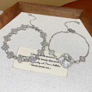 Detailed view of sparkling silver cubic zirconia flower bracelets in a wooden box