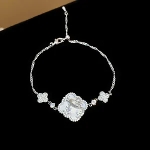 Detail view of a sparkling zircon flower bracelet with a four-leaf clover motif design.