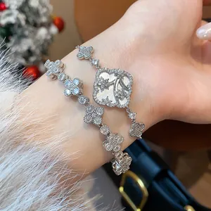 Close-up of elegant silver-tone flower bracelet set with sparkling cubic zirconia