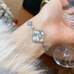 Elegant silver flower bracelet with sparkling zircons worn on a wrist for a luxury look