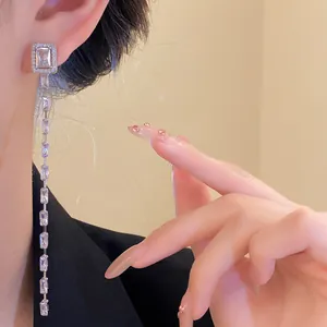 Elegant silver needle tassel earrings featuring sparkling rectangular zircon stones