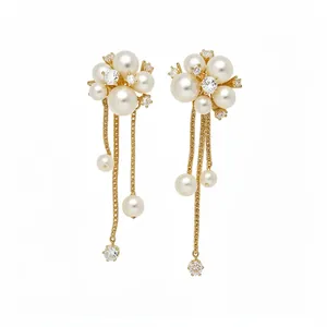 Elegant pearl and zirconia tassel flower stud earrings with a sophisticated gold-tone finish