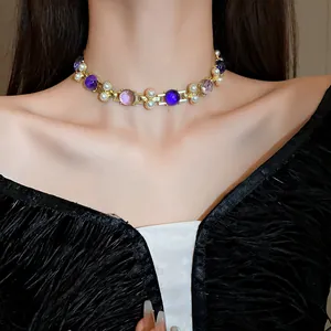 Elegant French vintage choker featuring white pearls and purple gems on a model neck.