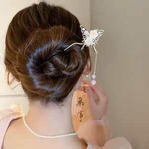 Close-up of a Chinese-style butterfly hair stick with pearl tassels worn in a bun