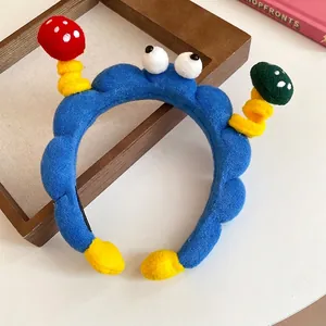 Funny blue plush headband featuring cartoon eyes and cute mushroom accents hair accessory
