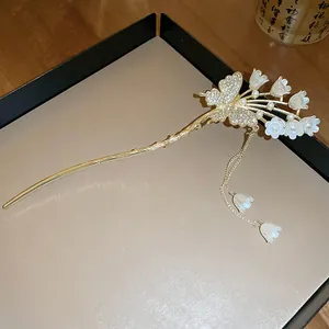 Elegant butterfly hair stick with rhinestones, pearls and lily of the valley flowers