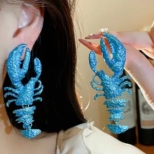 Statement blue lobster earrings with a unique textured spray paint finish for women