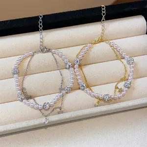 Elegant double-layered pearl and zircon star charm bracelets in gold and silver finish