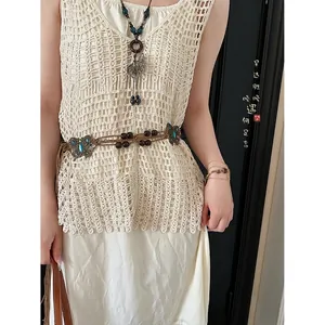 Bohemian braided waist chain with wooden beads and butterfly details on model