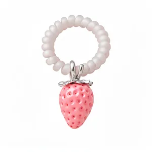 Cute pink resin strawberry pendant accessory with stainless steel leaf on white