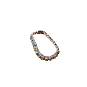 Elegant silver-toned bracelet with iridescent square crystals and fold-over clasp
