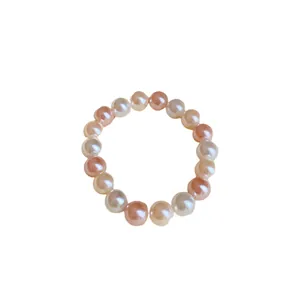 Elegant elastic bead bracelet featuring white and pink faux pearls for a sweet versatile look