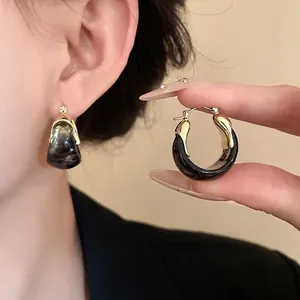 Vintage U-shaped basket hoop earrings with a unique dark smudged ink pattern