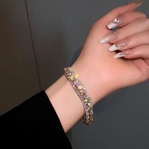 Close-up of sparkling rhinestone encrusted geometric link bracelet on wrist
