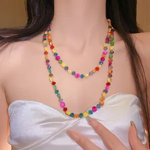 Close-up view of a Bohemian style colorful irregular crystal beaded multi-layer necklace