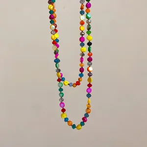 Detailed view of irregular colorful crystal beaded multi-layer necklace in bohemian style.
