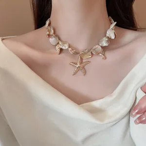 Close-up detail of a resort-style handmade shell necklace with a gold starfish pendant