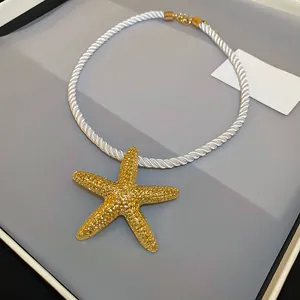 Luxurious gold-plated starfish pendant necklace with white twisted cord variant