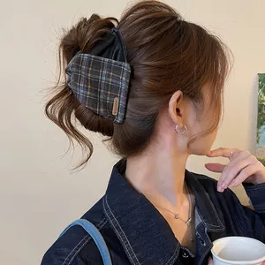 Vintage leather and plaid fabric hair claw clip for elegant and stylish back bun hair styling
