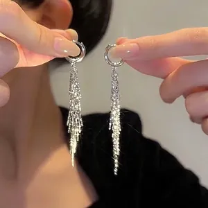 Elegant silver leaf tassel drop earrings featuring long shimmering rhinestone fringe