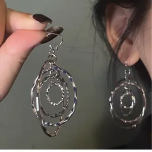 Elegant minimalist silver multi-layered geometric hoop earrings with hammered texture finish