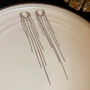 Minimalist silver water-drop long tassel earrings in a sleek snake chain design