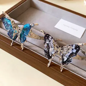 Elegant vintage butterfly pleated open bangle with metallic structure and resin wings