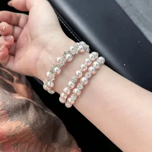Elegant multi-layer pink pearl bracelet with sparkling rhinestone accents for women