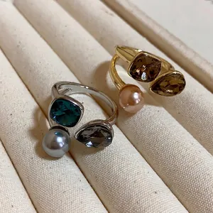 Elegant gold plated open rings featuring square crystals and round pearls in a vintage style