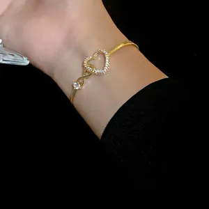 Elegant gold hollow heart bangle featuring sparkling zircons for a sweet and stylish look
