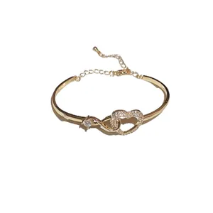 Elegant gold zircon heart hollow bangle with adjustable extension chain for women