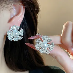 Elegant 18k gold plated flower earrings with central pearl and zircons for women