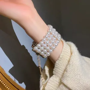 Elegant French style four-row white pearl bracelet with gold finish for women's wrist