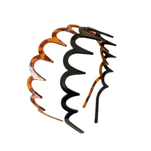 Set van twee zigzag golvende haarbanden in schildpad en zwart minimalistische stijl