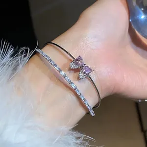 Elegant silver-tone bangle set with sparkling pink heart zircon bow and tennis bracelet