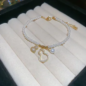 Elegant pearl bracelet with golden hulu charms and zircon inlay for women jewelry