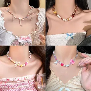 Four unique styles of Y2K dopamine beaded necklaces with bows and balloon dog charms