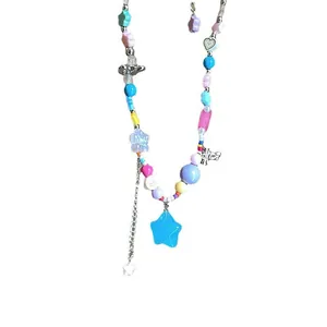 Vibrant Y2K style beaded necklace featuring a large blue star pendant and bow charms.