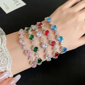 Elegant irregular zircon oval buckle bracelet in multiple colors on wrist shot