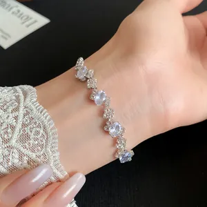 Close-up detail of an elegant irregular oval zirconia bracelet with a shiny silver finish