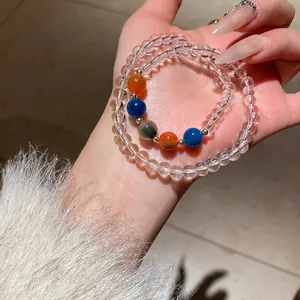 Close-up of crystal beaded bracelet with tiger eye stones and colorful beads