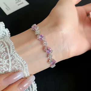Close-up showing pink oval zircons and sparkling stones on irregular bracelet
