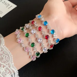 Detail of multiple colorful zircon bracelets with irregular oval-shaped stones
